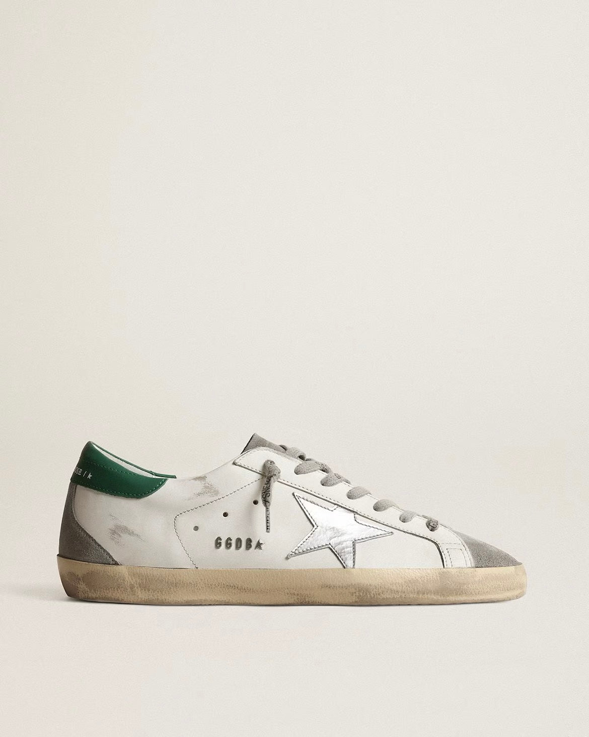 Men’s Super-Star in white leather with silver star and green heel tab