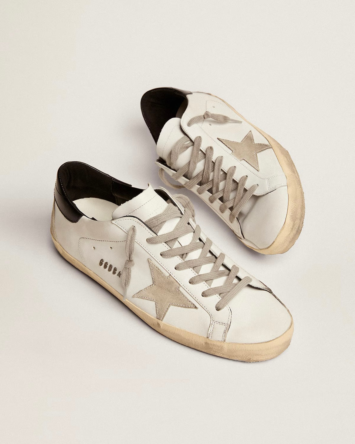 Men's Super-Star with black heel tab and metal stud lettering