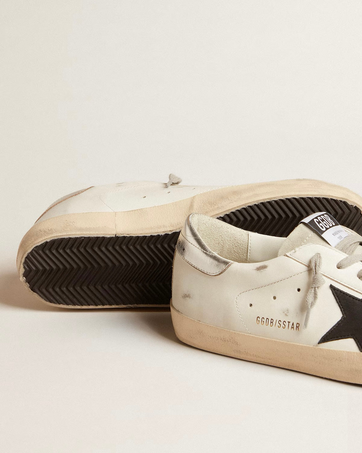Men's Super-Star in white leather with black nubuck star and silver metallic leather heel tab