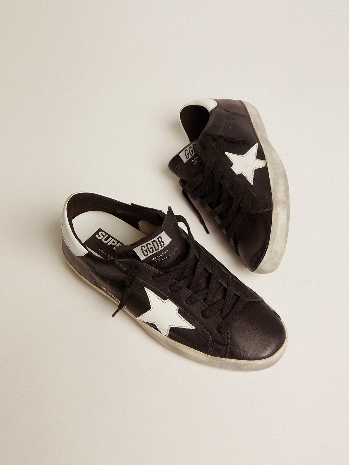 Women’s Super-Star in black leather with white leather star and heel tab