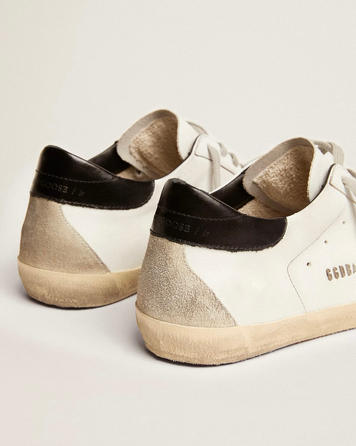 Men's Super-Star with black heel tab and metal stud lettering