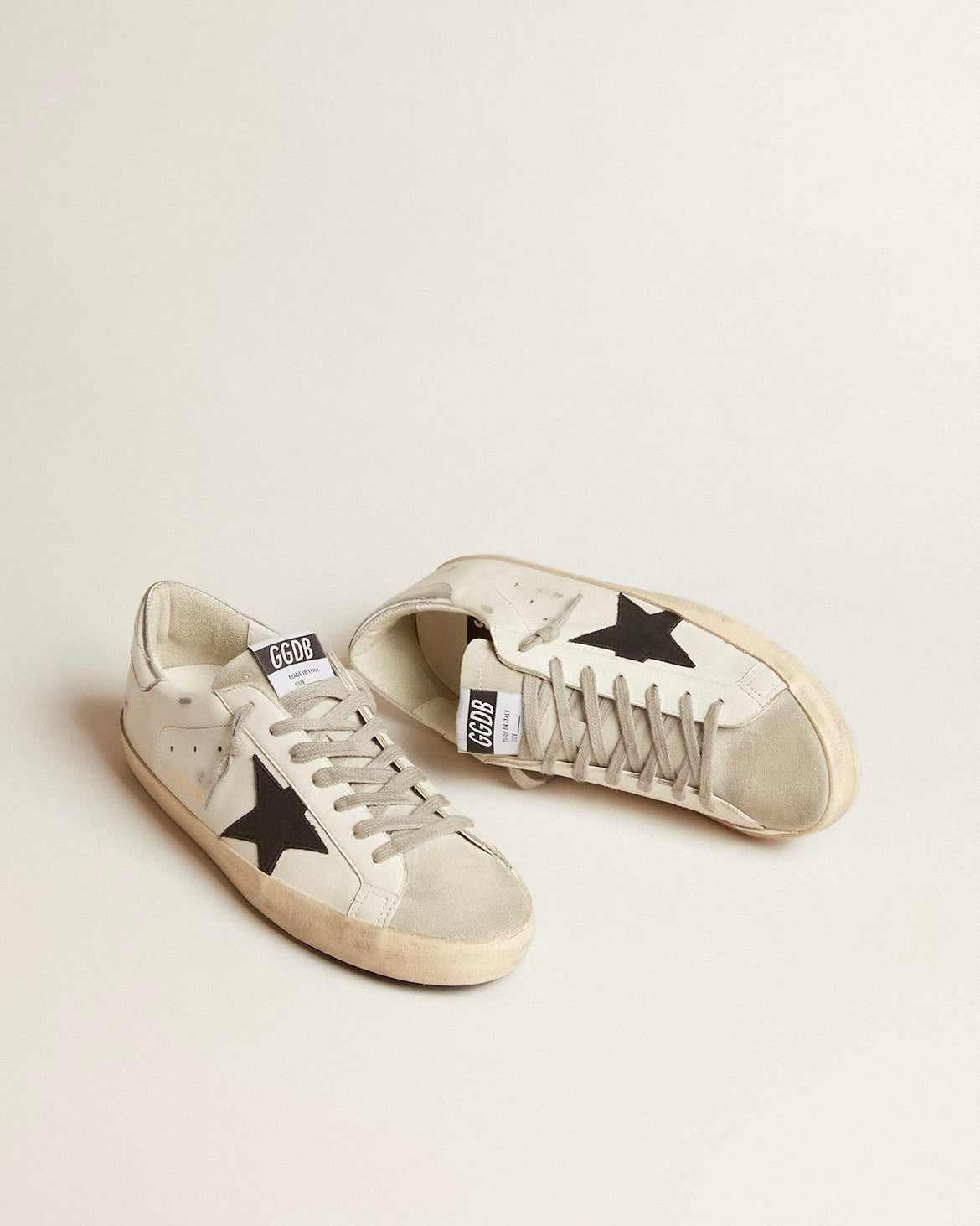 Men's Super-Star in white leather with black nubuck star and silver metallic leather heel tab