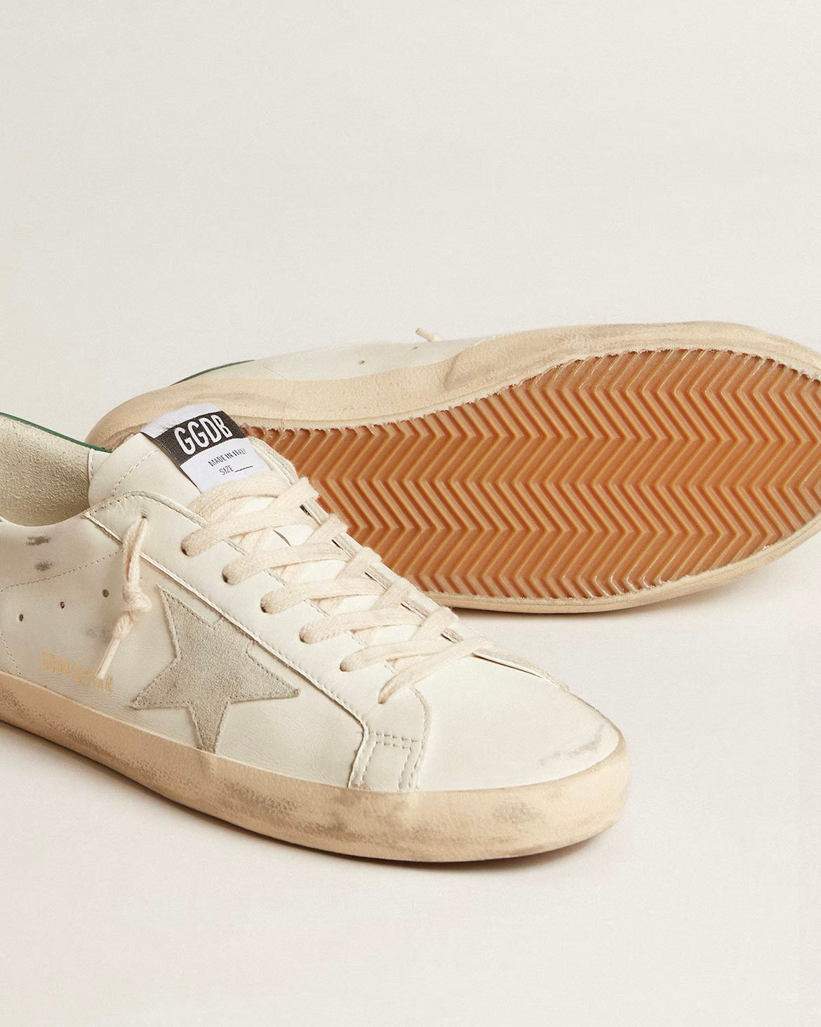 Super-Star in white leather with ice-gray suede star and green leather heel tab