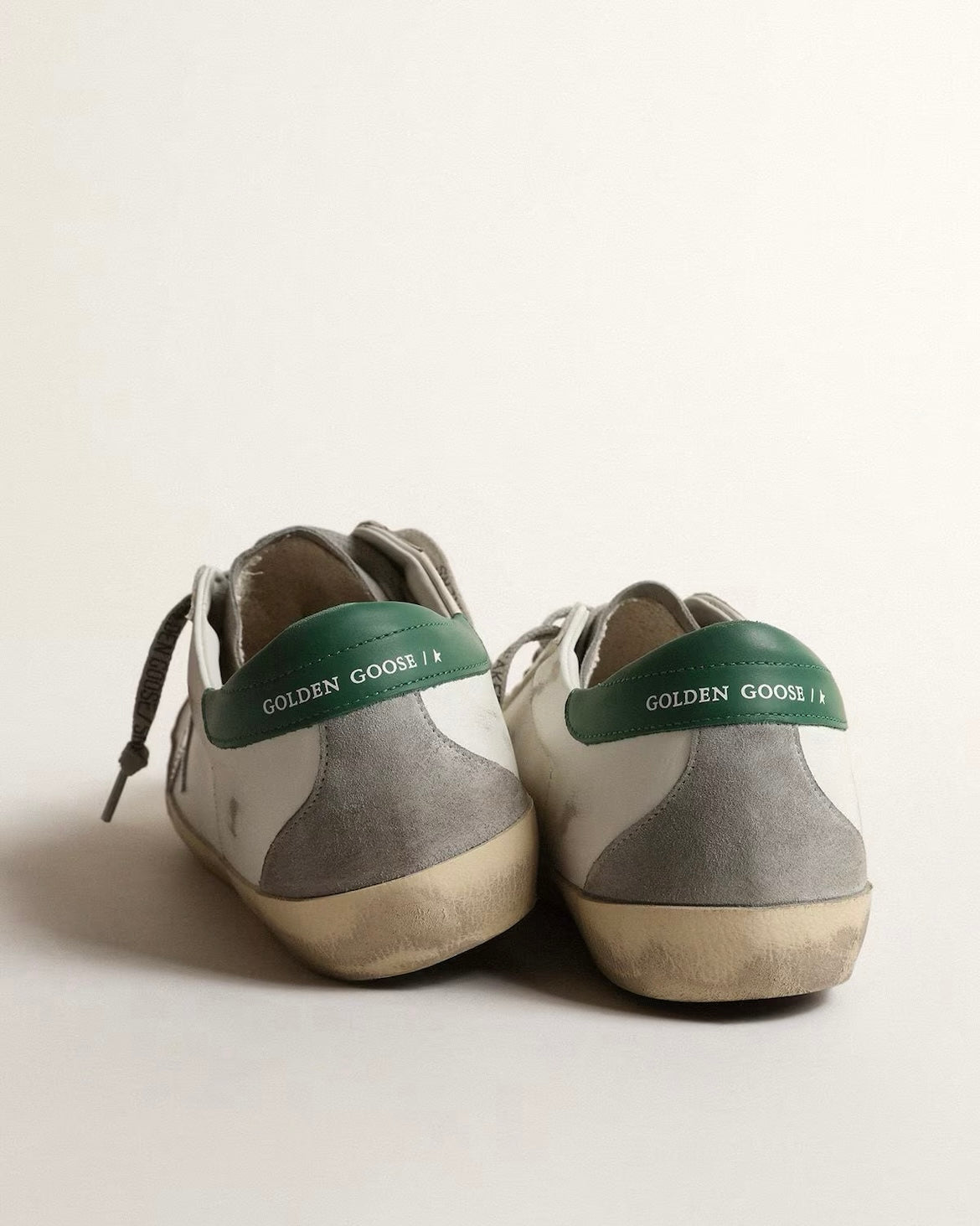 Men’s Super-Star in white leather with silver star and green heel tab