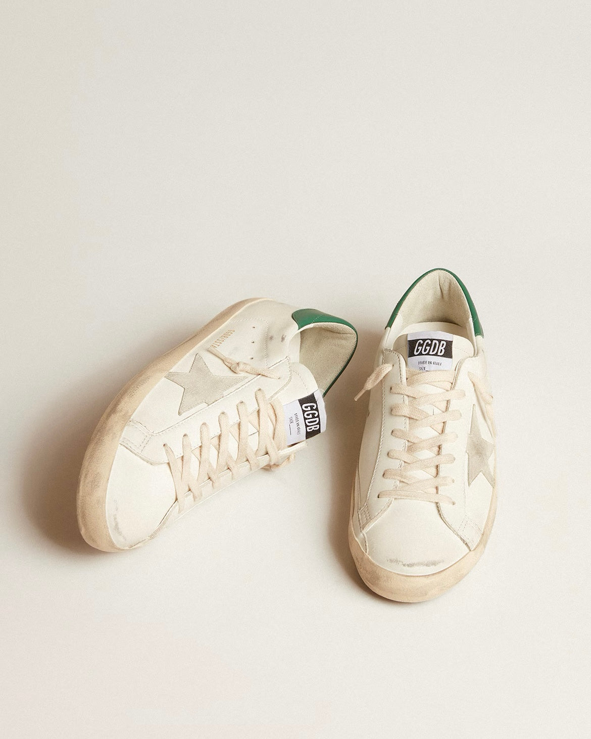 Super-Star in white leather with ice-gray suede star and green leather heel tab
